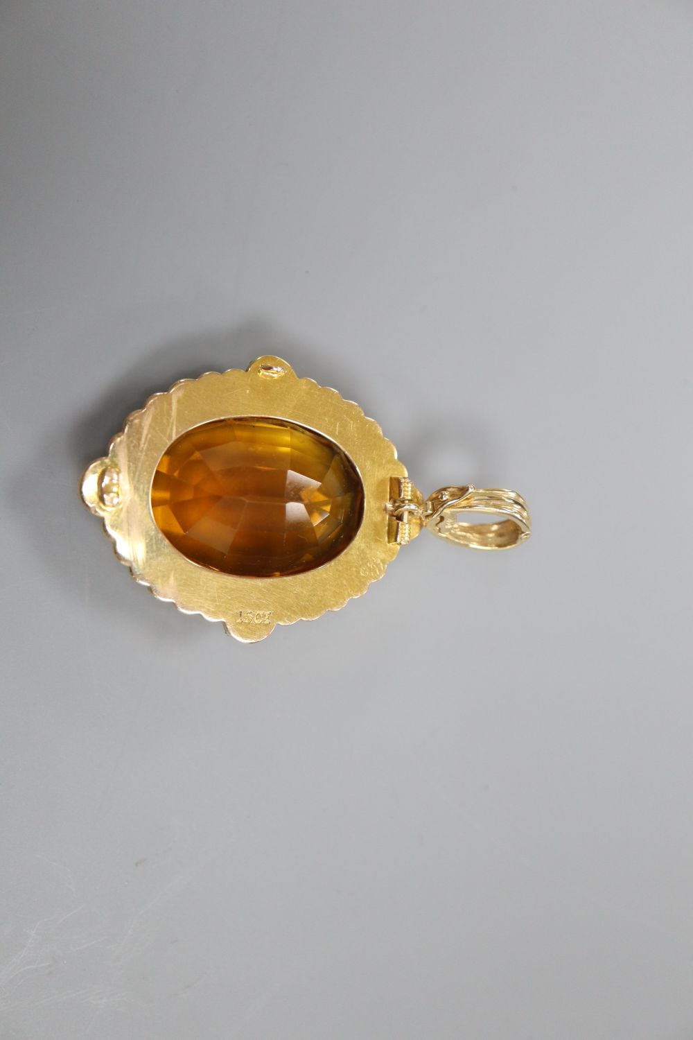 A citrine and seed pearl pendant, stamped 15ct, 3.5cm excluding 14k suspension loop,